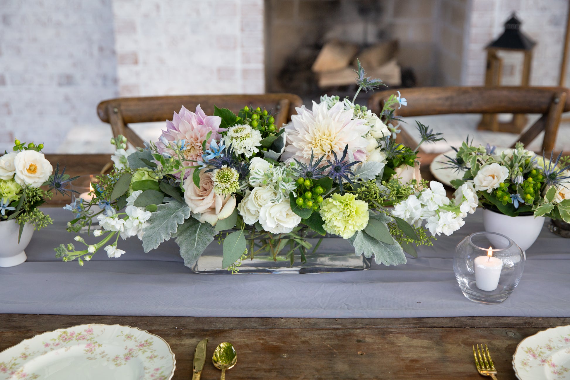 46 & Spruce glass rectangle vase 11 3/4 x 4 x 4 1/2 inch, beautifully showcasing a floral centerpiece arrangement, perfect for elegant table settings.