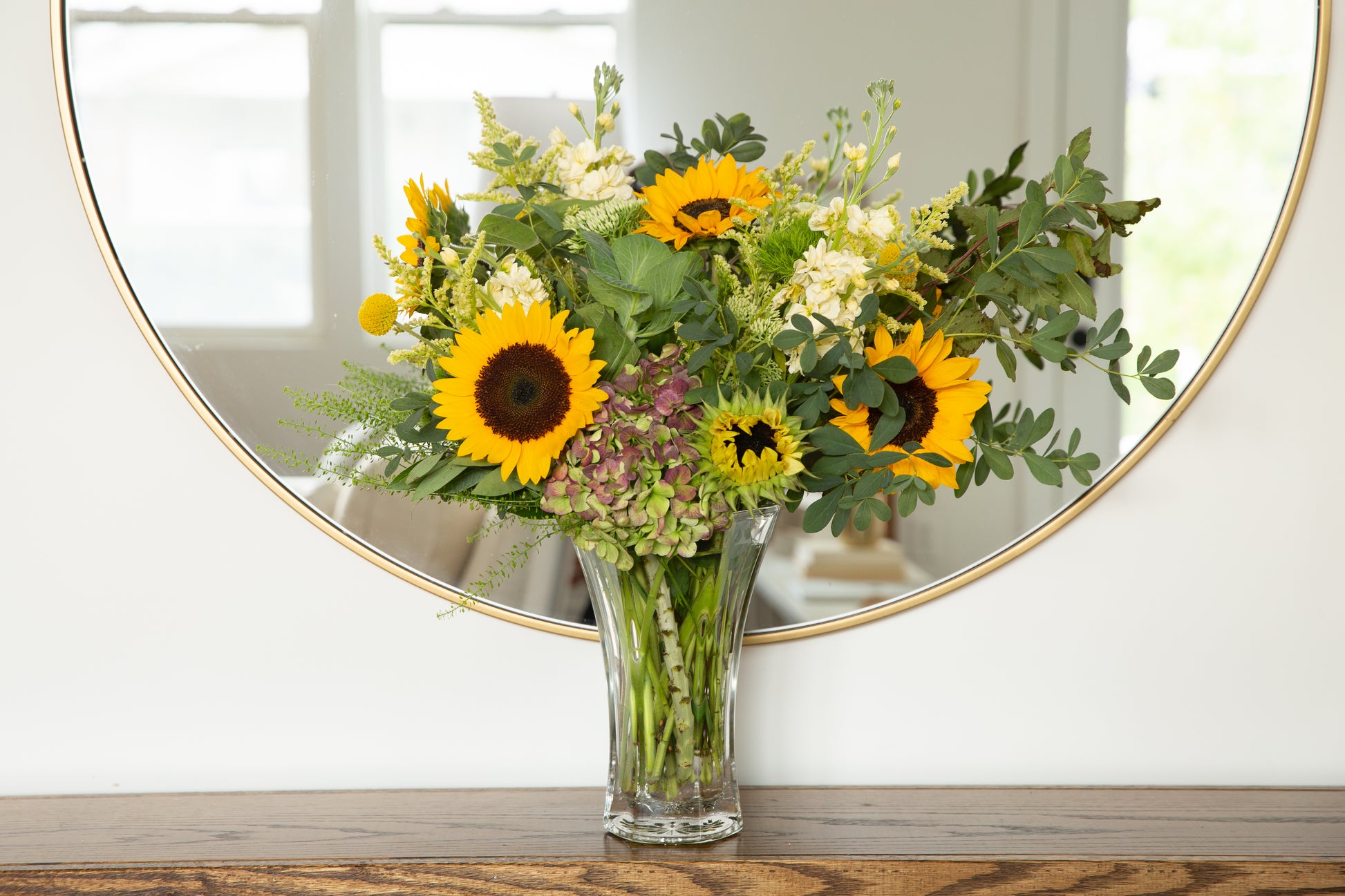 46 & Spruce flared glass vase 10 3/8 inch, featuring a beautiful sunflower bouquet, perfect for elegant home decor.