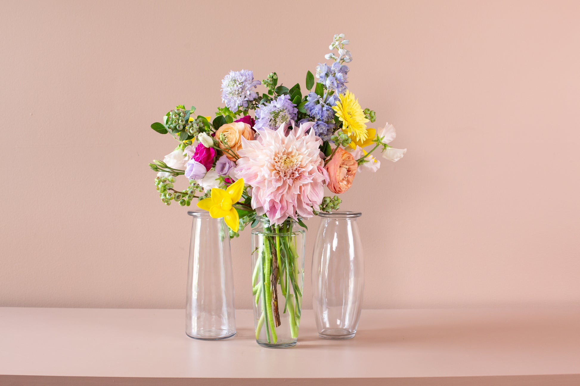 46 & Spruce 9-inch trio glass bouquet vase assortment, featuring a beautiful floral arrangement in three clear vases, perfect for elegant home decor.